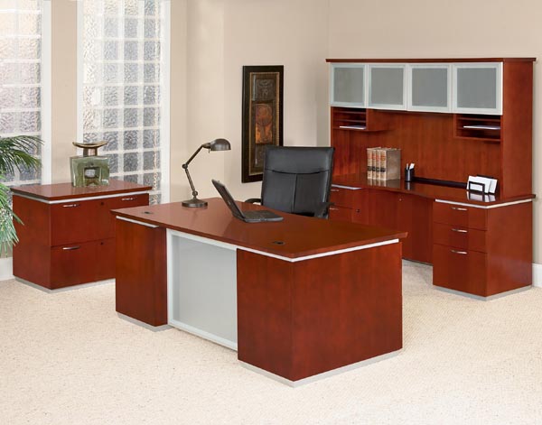 Pimlico cherry veneer executive office consisting of double ped desk, credenza, hutch with glass doors and two drawer lateral file from dmi office furniture